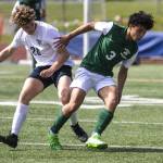 Edmonds-Woodways Richard Duncan (3) moves with the ball during a game against Southridge on May 20, 2023, in Edmonds. (Annie Barker / The Herald)