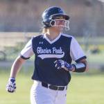 Glacier Peaks Samantha Christensen smiles as she runs around the bases after hitting a home run during the game against Snohomish on Friday, March 15, 2024 in Snohomish, Washington. (Olivia Vanni / The Herald)