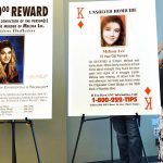 Sharon Lee (left), mother of Melissa Lee, stands by the posters of her daughter at an announcement that the Snohomish County Sheriffs Office had arrested a suspect in the 1993 cold case. (Sue Misao / The Herald)