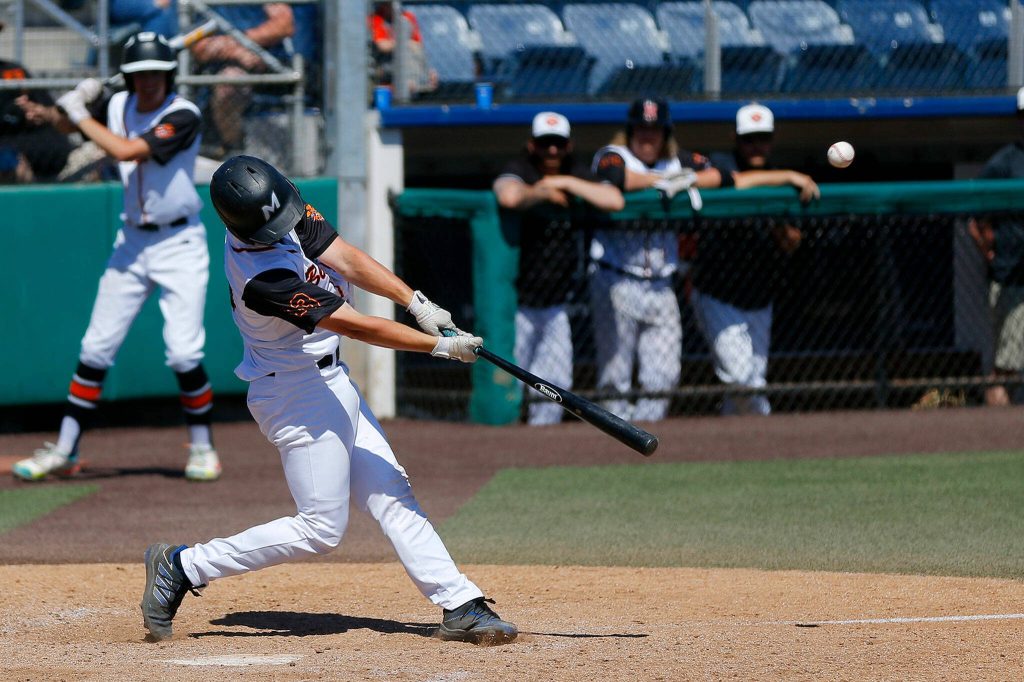 Monroes Cooper Barrow hits a sacrifice fly to extend his teams lead against Stanwood in a winner-to-state Class 3A District 1 tourament game May 13, 2023, at Funko Field in Everett. (Ryan Berry / The Herald)
