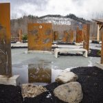 Custom-made tributes to families lost are displayed at the Oso Landslide Memorial on Monday, Feb. 26, 2024. (Annie Barker / The Herald)