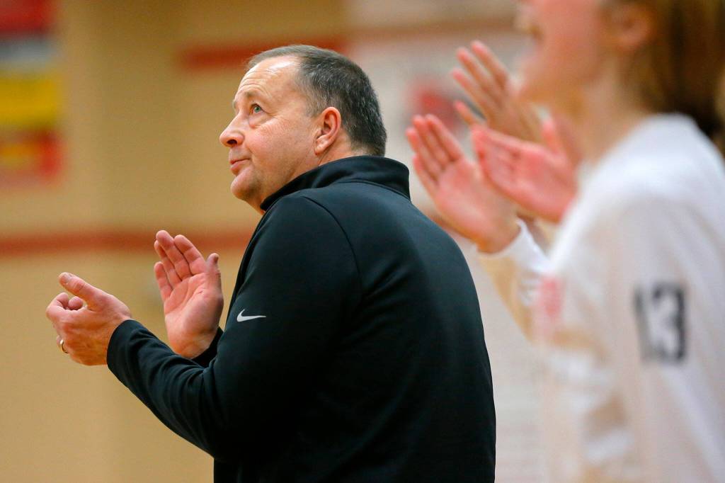 Snohomish head coach Ken Roberts claps for a players 3-pointer in against Stanwood on Jan. 13, 2023, at Snohomish High School in Snohomish. (Ryan Berry / The Herald)