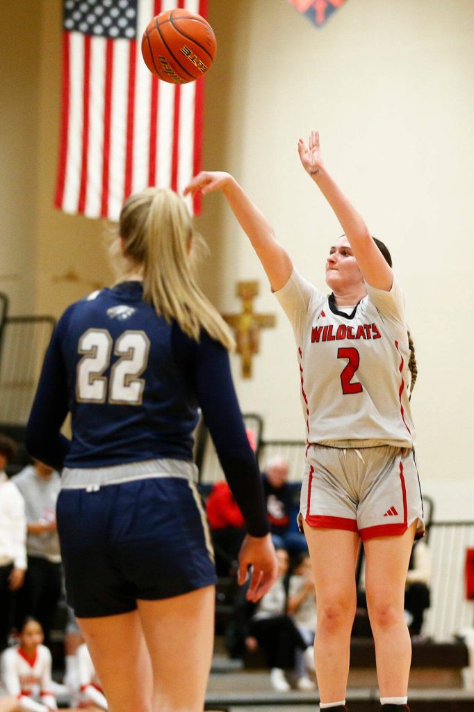 Archbishop Murphy sophomore Brooke Blachly shoots a 3-pointer against Arlington on Tuesday, Jan. 9, 2024, at Archbishop Murphy High School in Everett. (Ryan Berry / The Herald)