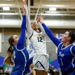 Everett senior Alana Washington scores in the paint against Seattle Prep during a state regionals matchup at Shorewood High School on Feb. 24 in Shoreline. (Ryan Berry / The Herald)