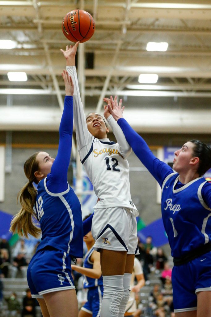 Everett senior Alana Washington scores in the paint against Seattle Prep during a state regionals matchup at Shorewood High School on Feb. 24 in Shoreline. (Ryan Berry / The Herald)