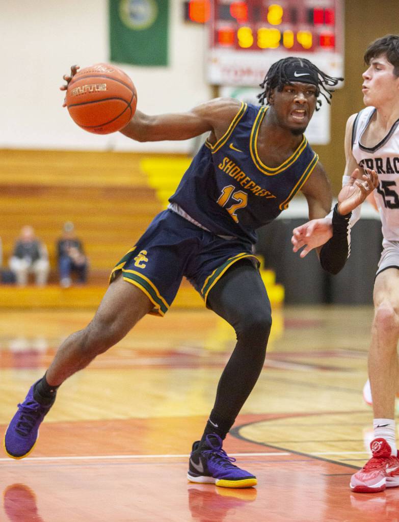 Shorecrests Junior Kagarabi drives with the ball during the game on Tuesday, Feb. 13, 2024 in Marysville, Washington. (Olivia Vanni / The Herald)