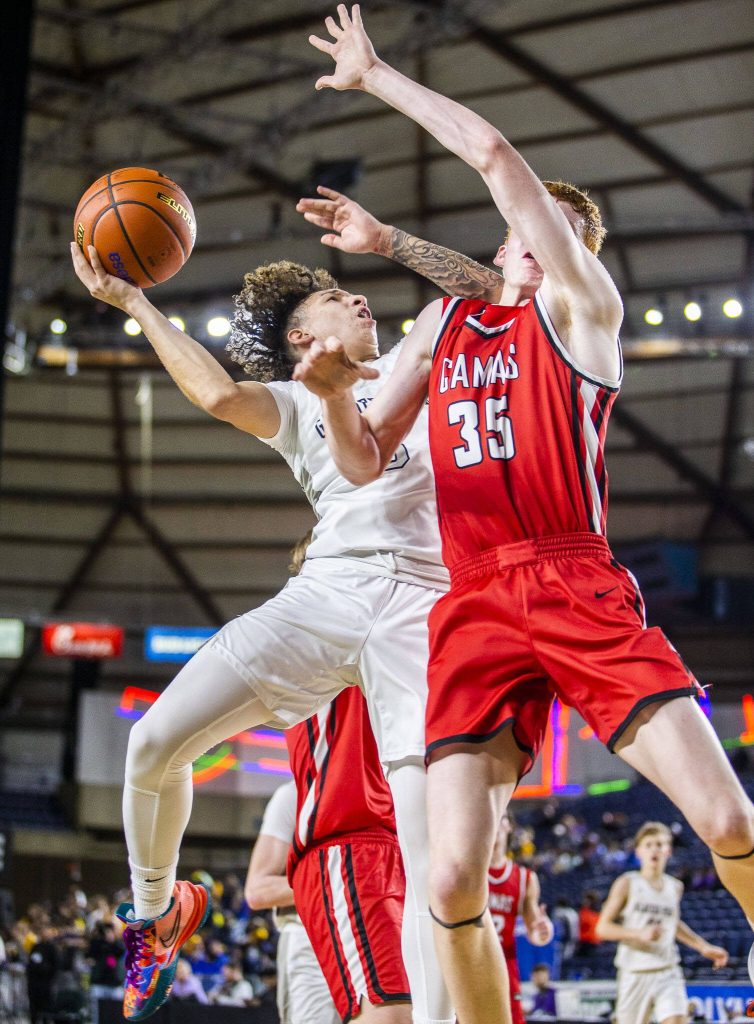 Glacier Peaks Isaiah Cuellar attempts a shot through contact during the 4A boys state basketball game against Camas on Wednesday, Feb. 28, 2024 in Tacoma, Washington. (Olivia Vanni / The Herald)