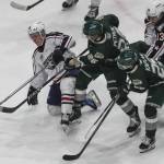 Silvertips’ Andrew Petruk (26) fights for the puck during a game between the Everett Silvertips and the Tri-City Americans at the Angel of the Winds Arena on Sunday, March 24, 2024 in Everett, Washington. (Annie Barker / The Herald)