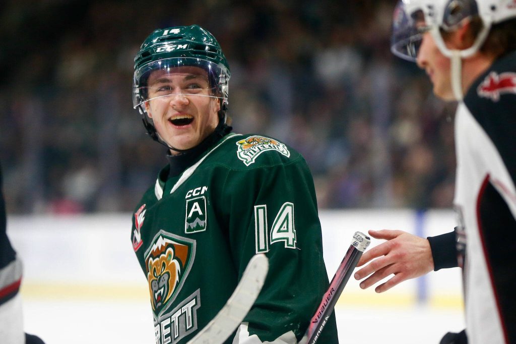 Everett Silvertips forward Austin Roest talks with a Vancouver Giants player after the whistle during the 2024 playoff opener on Friday, March 29, 2024, at Angel of the Winds Arena in Everrett, Washington. (Ryan Berry / The Herald)