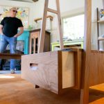 Allan Peterson stands beyond some of his handcrafted furniture inside the former horse stall that is now Milkwood on Sunday, March 31, 2024, in Index, Washington. (Ryan Berry / The Herald)