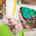 Multiple bags, including one titled How Mooo-ving are displayed on a wall at Milkwood on Sunday, March 31, 2024, in Index, Washington. (Ryan Berry / The Herald)