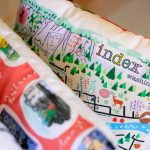 A number of pillows designed by Frances Peterson are sold at Milkwood on Sunday, March 31, 2024, in Index, Washington. (Ryan Berry / The Herald)