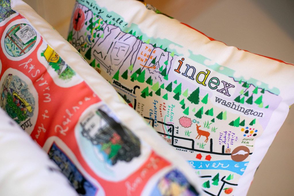 A number of pillows designed by Frances Peterson are sold at Milkwood on Sunday, March 31, 2024, in Index, Washington. (Ryan Berry / The Herald)