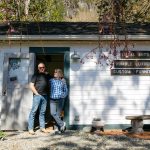 Allan and Frances Peterson, a woodworker and artist respectively, stand in the door of the old horse stable they turned into Milkwood on Sunday, March 31, 2024, in Index, Washington. (Ryan Berry / The Herald)