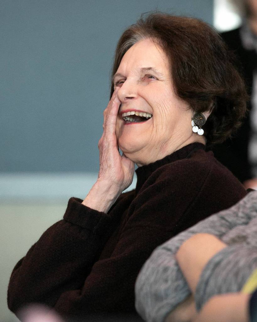 Nancy, wife of Galloping Gourmet Graham Kerr, beams while listening to her new husband speak during Senior Expo on Tuesday, March 26, 2024, at Hotel Indigo in Everett, Washington. (Ryan Berry / The Herald)