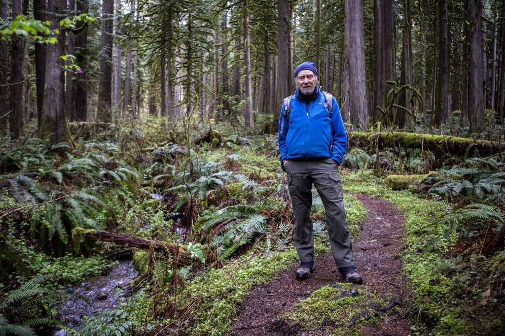 Russ Dalton poses for a photo at Rockport State Park on Wednesday, April 3, 2024 in Rockport, Washington. (Annie Barker / The Herald)