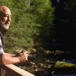 Paul Paquet, an author and expert on bears and wolves, watches for bears from a viewing stand overlooking a salmon stream on Gribbell Island, on the north coast of British Columbia, Canada, on Oct. 13, 2006. (Tom Uhlenbrock/St. Louis Post-Dispatch/MCT)