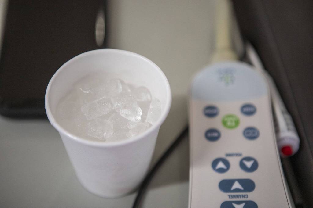 Ice sits in a cup while Harold Jones receives dialysis treatment at NW Kidney Dialysis Center on Thursday, April 4, 2024 in Everett, Washington. (Annie Barker / The Herald)