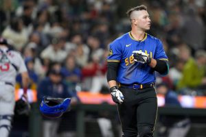 Seattle Mariners Ty France tosses his helmet after striking out against the Boston Red Sox in a baseball game Friday, March 29, 2024, in Seattle. (AP Photo/Lindsey Wasson)