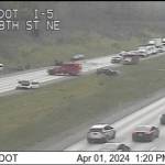 Traffic camera footage shows a crash on northbound I-5 near Arlington that closed all lanes of the highway Monday afternoon. (Washington State Department of Transportation)