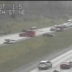 Traffic camera footage shows a crash on northbound I-5 near Arlington that closed all lanes of the highway Monday afternoon. (Washington State Department of Transportation)