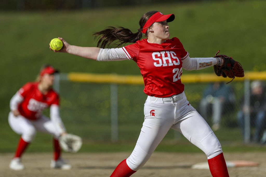 Stanwoods Addi Anderson (20) pitches during a prep softball game between Stanwood and Jackson at Henry M. Jackson High School on Tuesday, April 2, 2024 in Mill Creek, Washington. Jackson won, 6-0. (Annie Barker / The Herald)