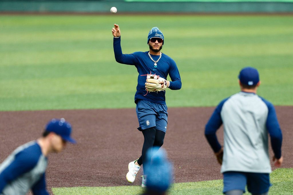 Everett AquaSox infielder Axel Sanchez throws a ball back to the mound during practice Tuesday, April 2, 2024, at Funko Field in Everett, Washington. (Ryan Berry / The Herald)