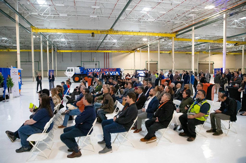 People gather during an event at ZeroAvias new facility on Wednesday, April 24, 2024, near Paine Field in Everett, Washington. (Ryan Berry / The Herald)
