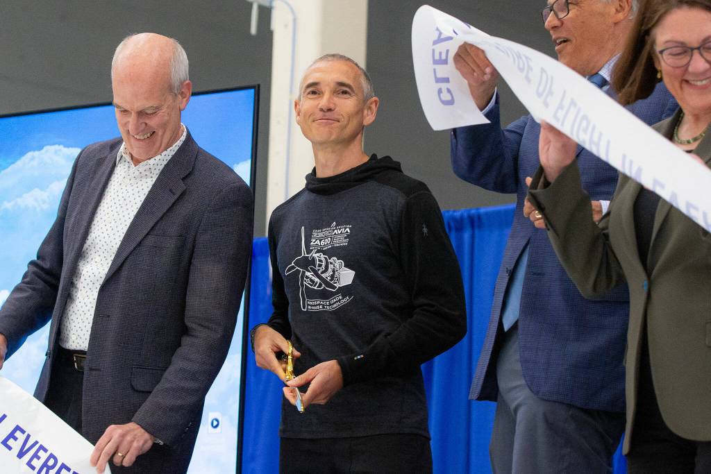 Val Miftakhov smiles after cutting the ribbon alongside Rep. Rick Larsen, left, Gov. Jay Inslee and Rep. Suzan DelBene, far right, during an event at ZeroAvias new facility on Wednesday, April 24, 2024, near Paine Field in Everett, Washington. (Ryan Berry / The Herald)