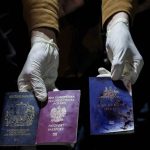 Blood-stained British, Polish and Australian passports of dead aid workers are held for a camera after an Israeli airstrike, in Deir al-Balah, Gaza Strip, April 1. Gaza medical officials said an Israeli airstrike killed international aid workers with the World Central Kitchen charity and their Palestinian drivers after they helped deliver food and other supplies to northern Gaza that had arrived hours earlier by ship. (Abdel Kareem Hana / Associated Press)