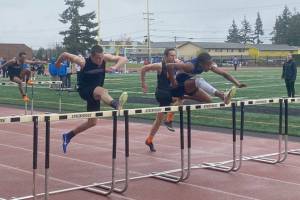 Mariner's Stephen Anderson leads the pack in the boys 110-meter hurdles during a meet Thursday at Goddard Stadium. (Evan Wiederspohn / The Herald)