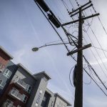 New housing and power lines that will be moved underground as part of the development of the Mountlake Terrace Town Center on Wednesday, April 10, 2024 in Mountlake Terrace, Washington. (Olivia Vanni / The Herald)