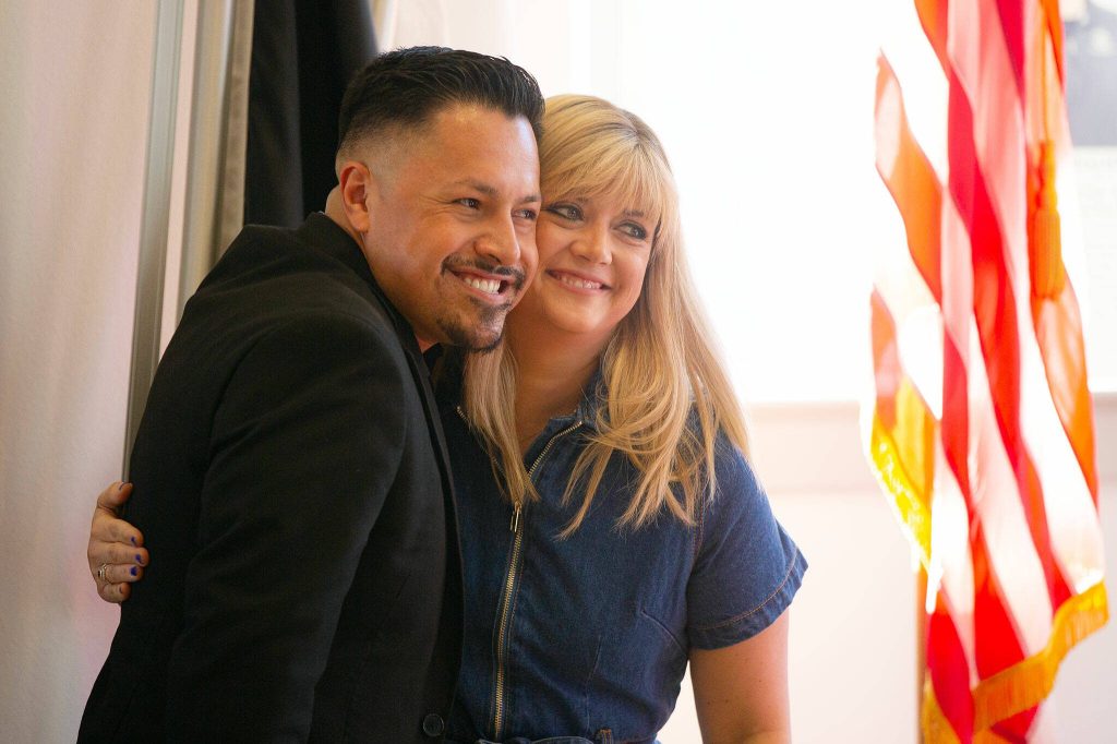 Nominees Jonnathan Yepez Carino and Alexandria McGinty share a hug during the 2024 Snohomish County Emerging Leaders Awards Presentation on Wednesday, April 17, 2024, in Everett, Washington. (Ryan Berry / The Herald)