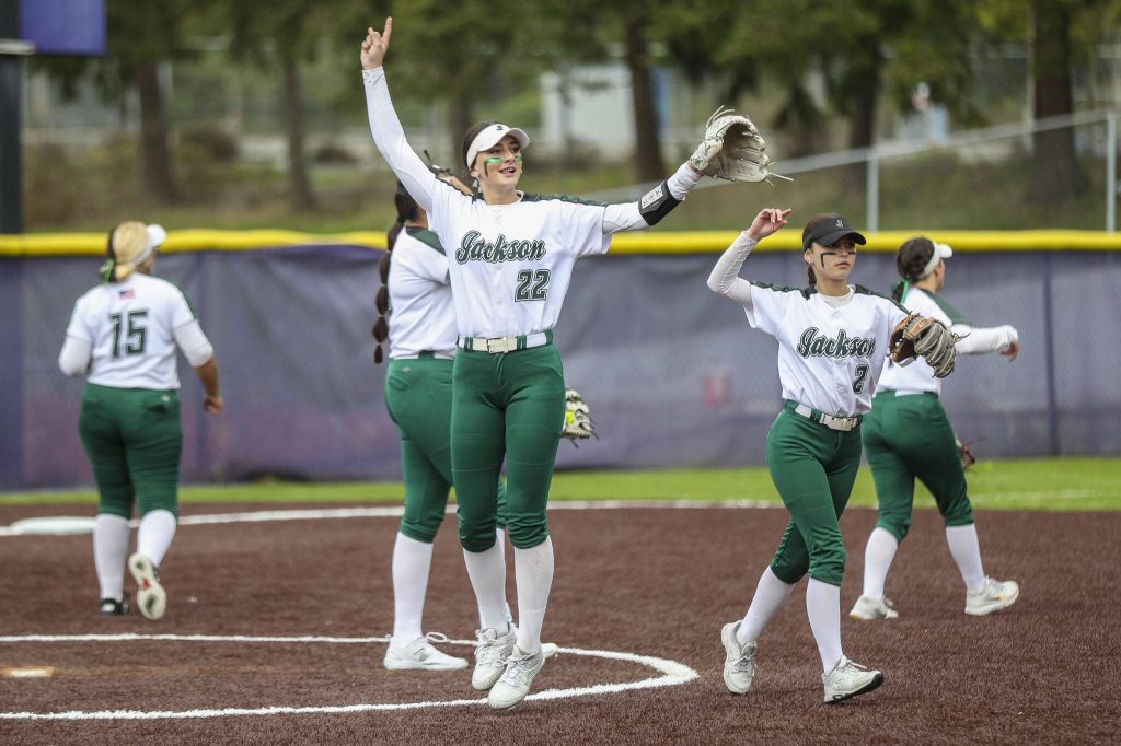 Jackson players celebrate during a 4A softball game between Kamiak and Jackson at Kamiak High School on Tuesday, April 9, 2024 in Mukilteo, Washington. Jackson won, 9-0. (Annie Barker / The Herald)
