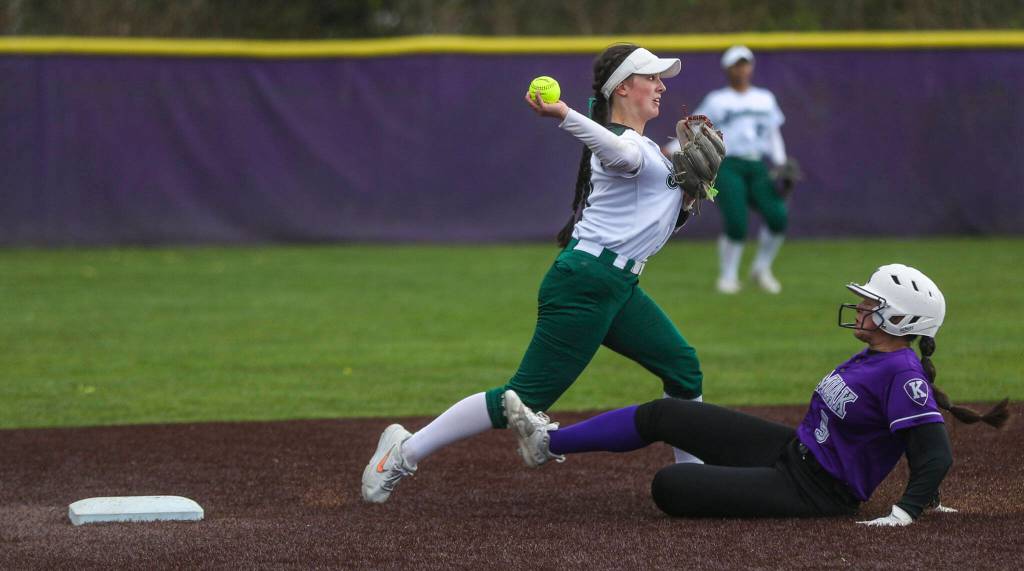 Jacksons Rachel Sysum (11) gets an out at second during a 4A softball game between Kamiak and Jackson at Kamiak High School on Tuesday, April 9, 2024 in Mukilteo, Washington. Jackson won, 9-0. (Annie Barker / The Herald)