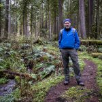 Russ Dalton poses for a photo at Rockport State Park on Wednesday, April 3, 2024 in Rockport, Washington. (Annie Barker / The Herald)