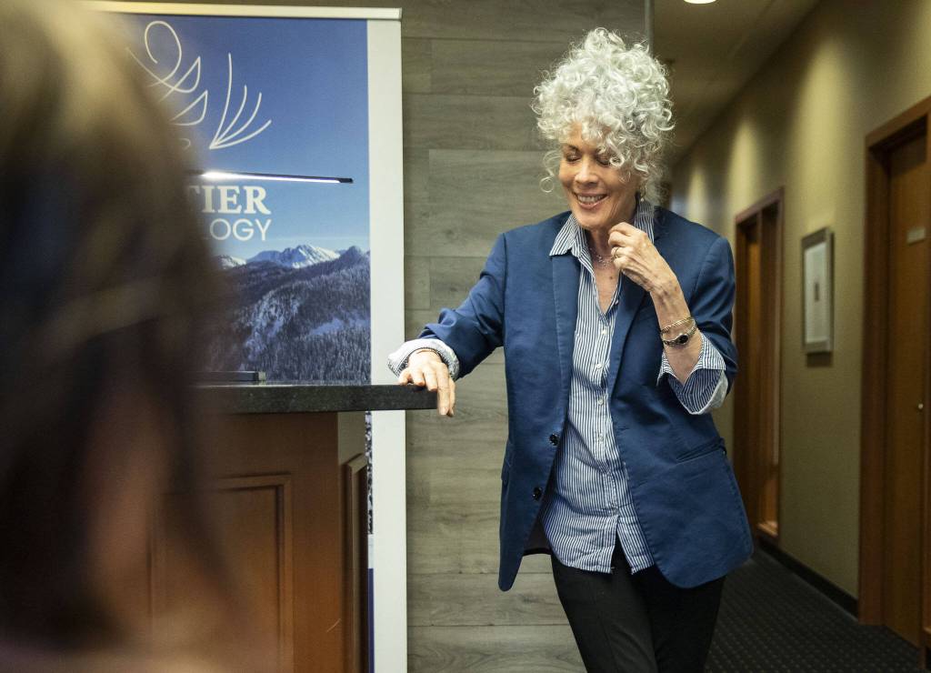 Dermatology patient Sheryl Cayford speaks about her experience with GentleCure on Wednesday, April 17, 2024 in Mill Creek, Washington. (Olivia Vanni / The Herald)