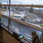 People look out onto Mountain Loop Mine from the second floor hallway of Fairmount Elementary on Wednesday, Jan. 10, 2024 in Everett, Washington. (Olivia Vanni / The Herald)