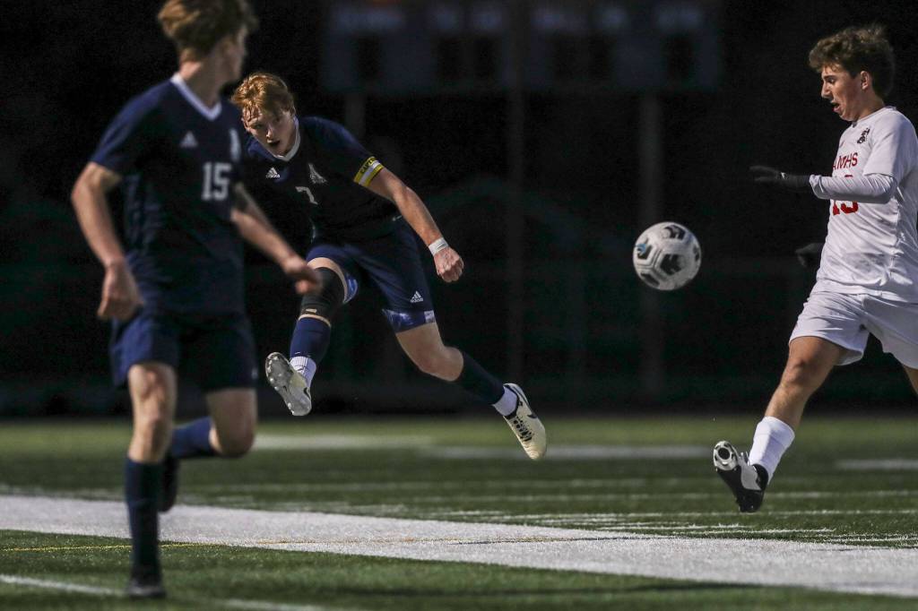 Arlingtons Aidan Raney (7) kicks the ball during a boys soccer game between Archbishop Murphy and Arlington at Arlington High School on Monday, April 15, 2024 in Arlington, Washington. (Annie Barker / The Herald)