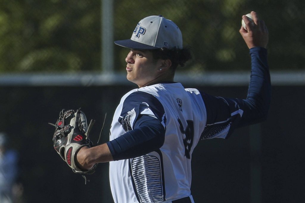 Glacier Peaks Emmett Brown (20) pitches during a baseball game between Jackson and Glacier Peak at Glacier Peak High School on Tuesday, April 16, 2024 in Snohomish, Washington. Glacier Peak won 3-0. (Annie Barker / The Herald)