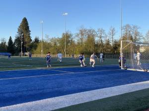 Shorewoods Netan Ghebreamlak prepares to take a shot as Edmonds-Woodways Kincaid Sund defends in the Warriors 2-1 victory Wednesday night at Shoreline Stadium. (Aaron Coe / The Herald)