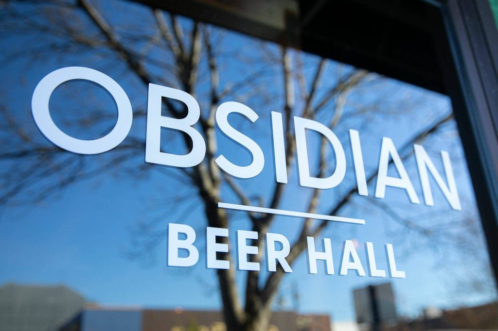 The front door of Obsidian Beer Hall on Friday, April 12, 2024, in downtown Everett, Washington. (Ryan Berry / The Herald)