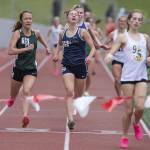 Glacier Peaks Clara Diepenbrock grimaces as she crosses the finish line in the girls 1,600 metera during the Eason Invitational at Snohomish High School on Saturday, April 20, 2024 in Snohomish, Washington. (Olivia Vanni / The Herald)