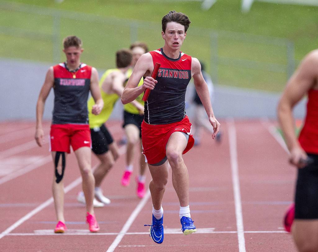 The anchor for the Stanwoods boys 1,600-meter relay runs during the Eason Invitational at Snohomish High School on Saturday, April 20, 2024 in Snohomish, Washington. (Olivia Vanni / The Herald)