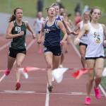 Glacier Peaks Clara Diepenbrock grimaces as she crosses the finish line in the girls 1,600 meters during the Eason Invitational at Snohomish High School on Saturday, April 20, 2024 in Snohomish, Washington. (Olivia Vanni / The Herald)