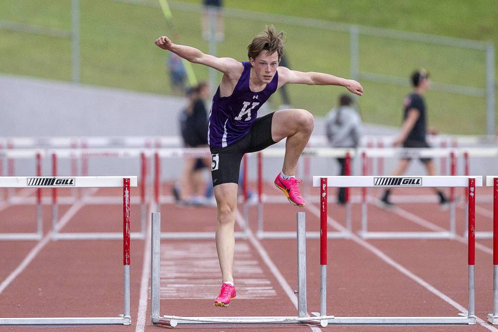 Kamiaks Miller Warme knocks over the final hurdle before crossing the finish line in the boys 300-meter hurdles during the Eason Invitational at Snohomish High School on Saturday, April 20, 2024 in Snohomish, Washington. (Olivia Vanni / The Herald)
