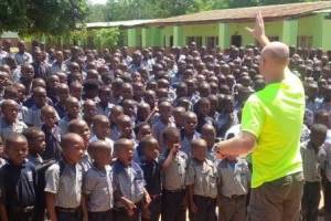 Matt Raney stands in front of a group of children in Eswatini (formerly Swaziland), Africa in 2011. The Raney family began their nonprofit organization, Adventure Soccer, in 2003 in Snohomish County, and they expanded their work into Africa in 2010. (Photo courtesy of Matt Raney)