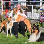 Corinne Boon poses with three collies she bred: 2 year-old Tsunami, left, 5-year-old Maree, on lap, and 2-year-old Vision. The dogs have been going to sheep school, where they learn how to herd sheep, Boon said. (Luisa Loi / Whidbey News-Times)