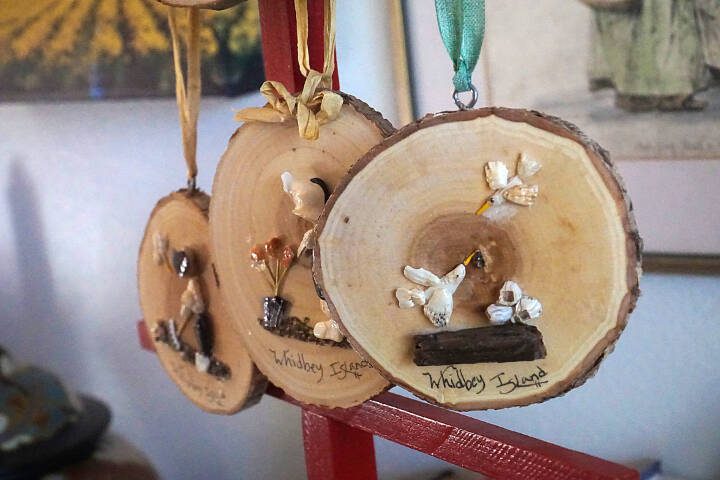 Artist Libby Hammer creates scenes inspired by her own life using bits and pieces of rocks and shells she finds while beachcombing on Whidbey Island. (Sam Fletcher / Whidbey News-Times)