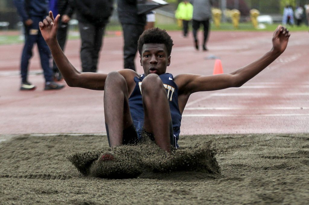 Everetts Shukurani Ndayiragije participates in the triple jump event during a track meet between Lynnwood, Everett, and Edmonds-Woodway at Edmonds District Stadium on Thursday, April 25, 2024 in Edmonds, Washington. (Annie Barker / The Herald)
